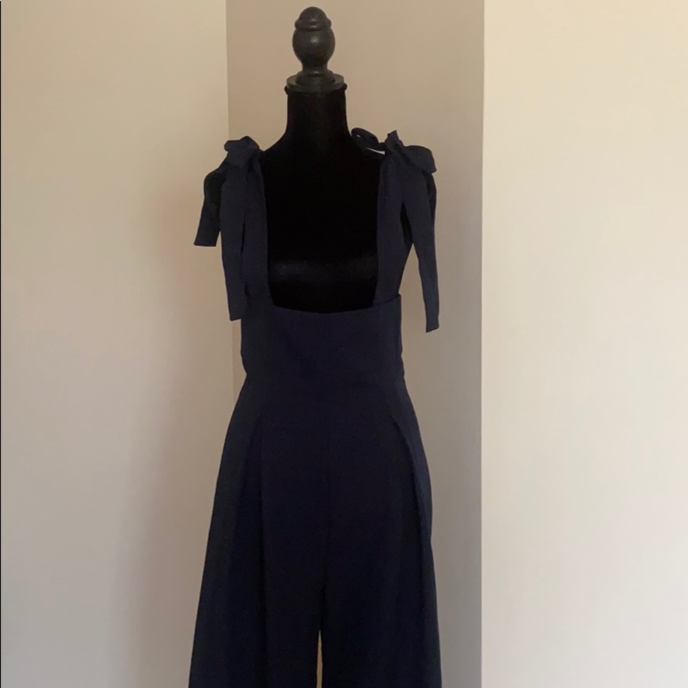 Navy blue jumper with ties.